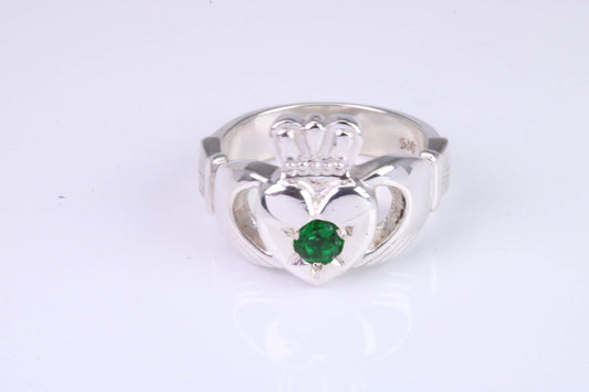 Large and heavy Emerald Green C Z set Claddagh ring, made from solid cast silver, British hallmarked