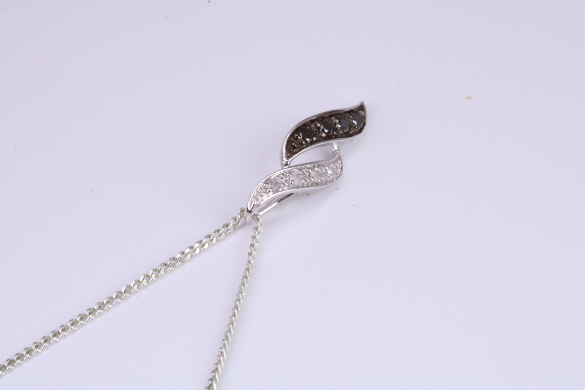 Black and White Natural Diamonds set solid White Gold Pendant with 18 inch long Chain
