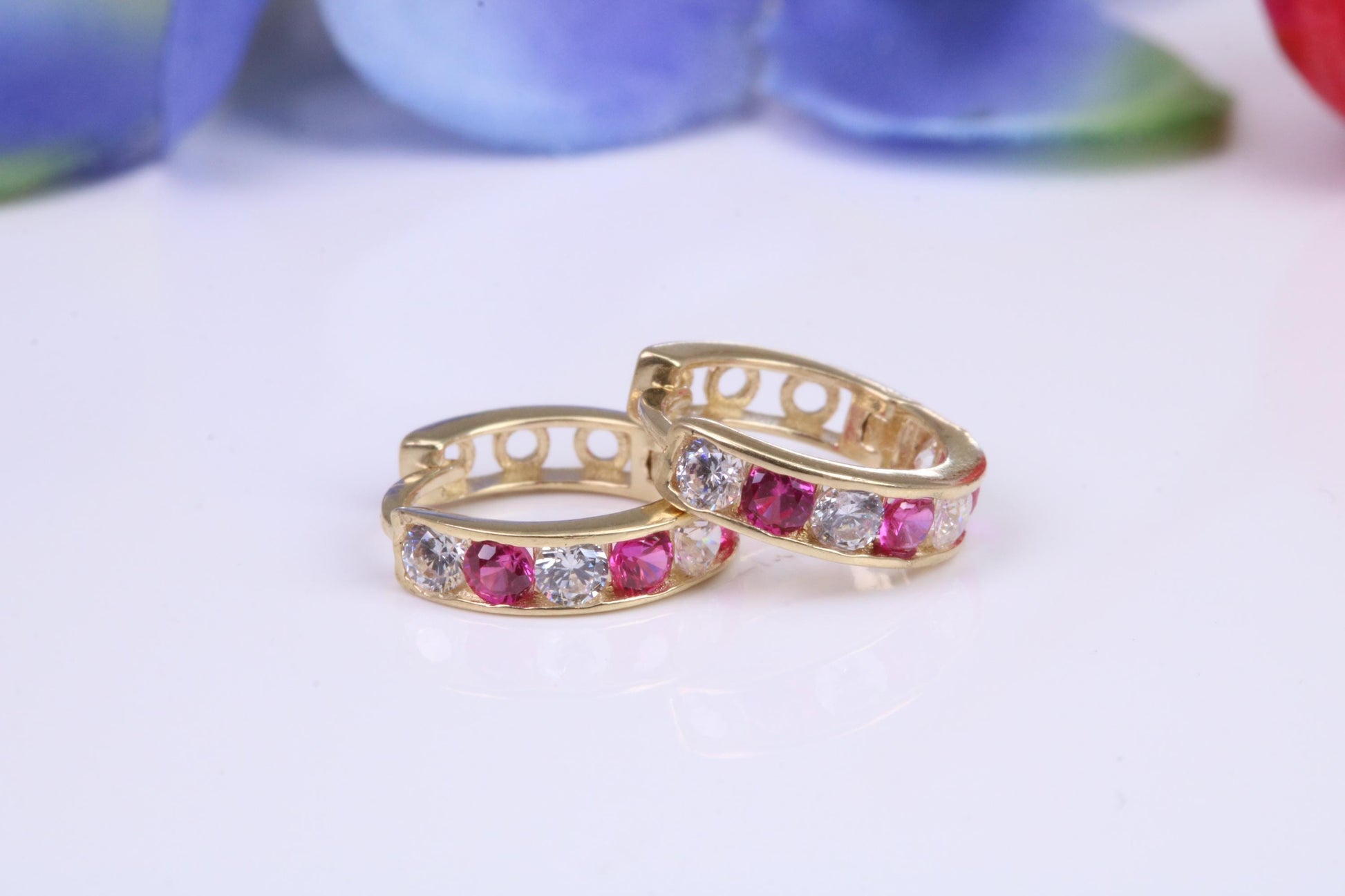10 mm round hinged hoop earrings, made from solid yellow gold and set with Ruby and Diamond Cubic Zirconia