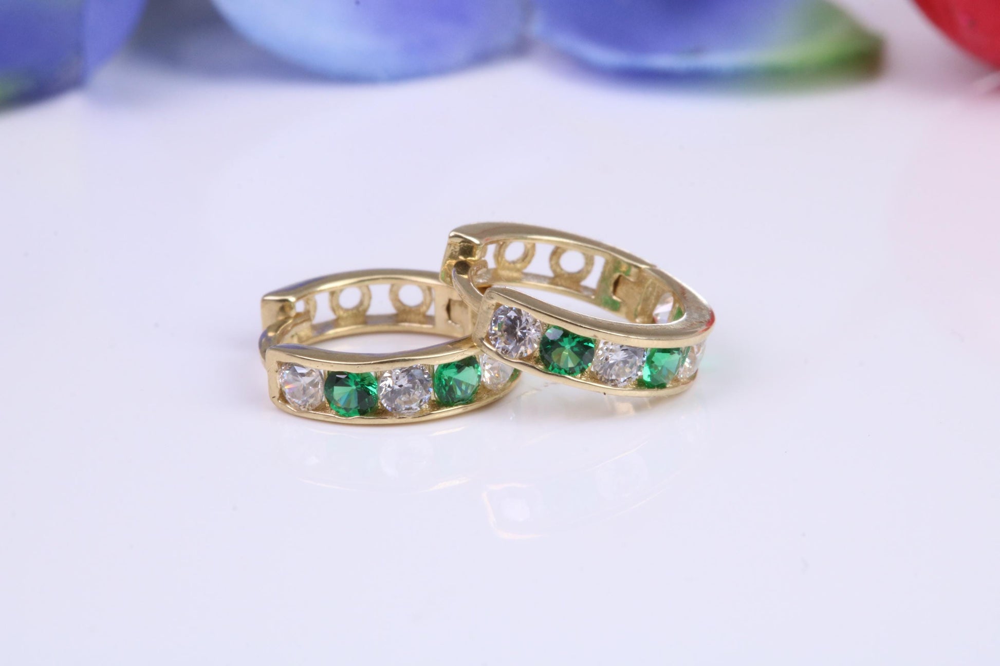 10 mm round hinged hoop earrings, made from solid yellow gold and set with Emerald and Diamond Cubic Zirconia