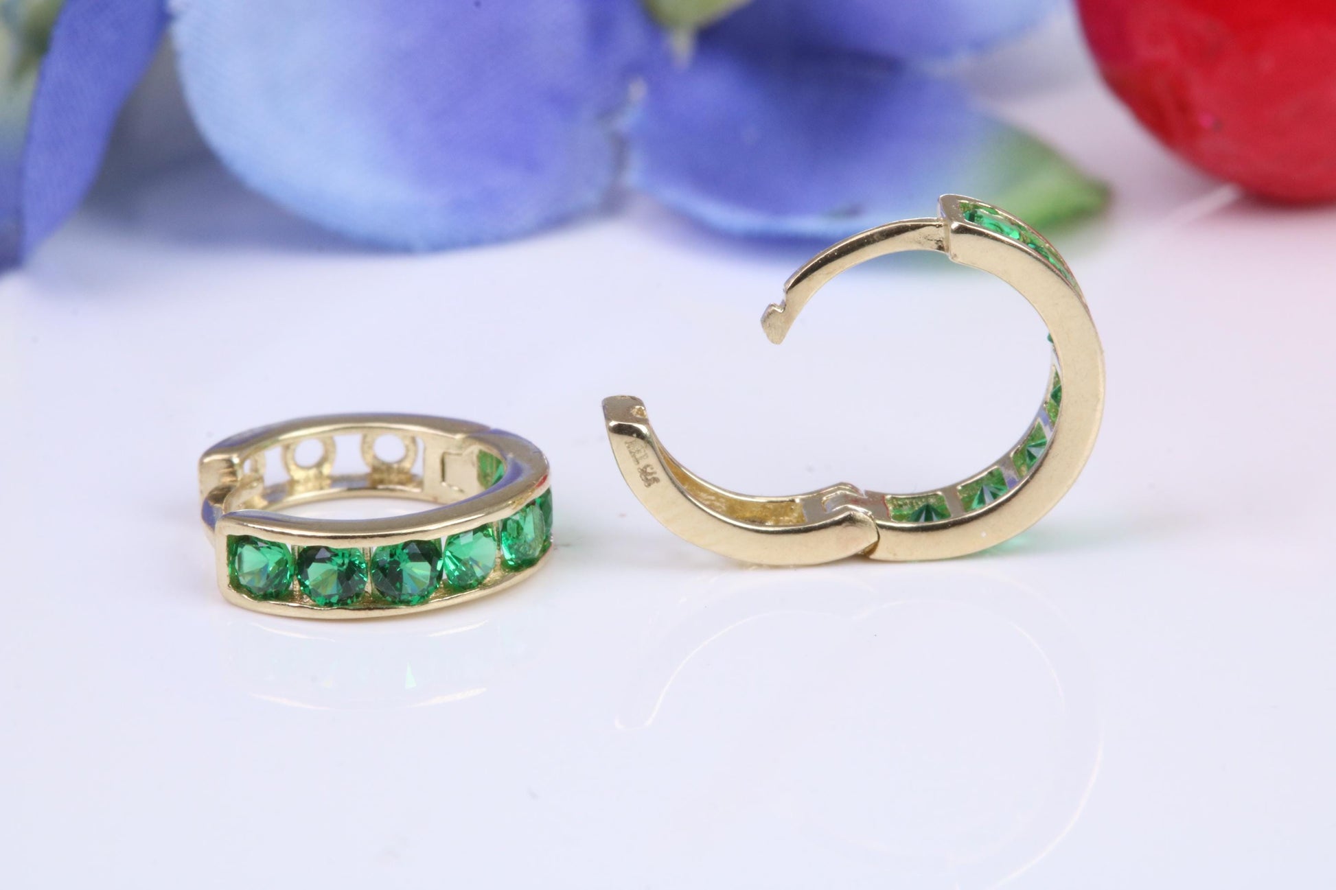 10 mm round hinged hoop earrings, made from solid yellow gold and set with Emerald Green Cubic Zirconia