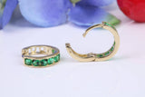 10 mm round hinged hoop earrings, made from solid yellow gold and set with Emerald Green Cubic Zirconia