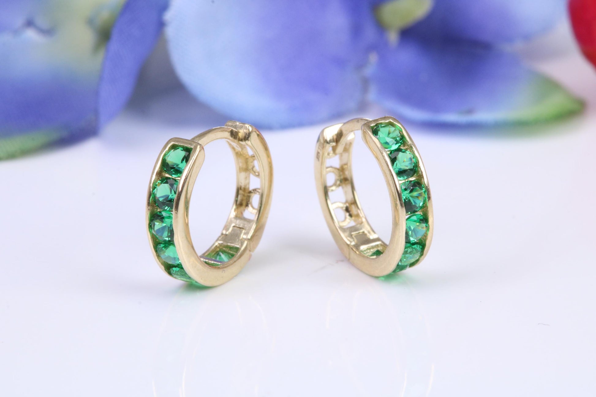 10 mm round hinged hoop earrings, made from solid yellow gold and set with Emerald Green Cubic Zirconia