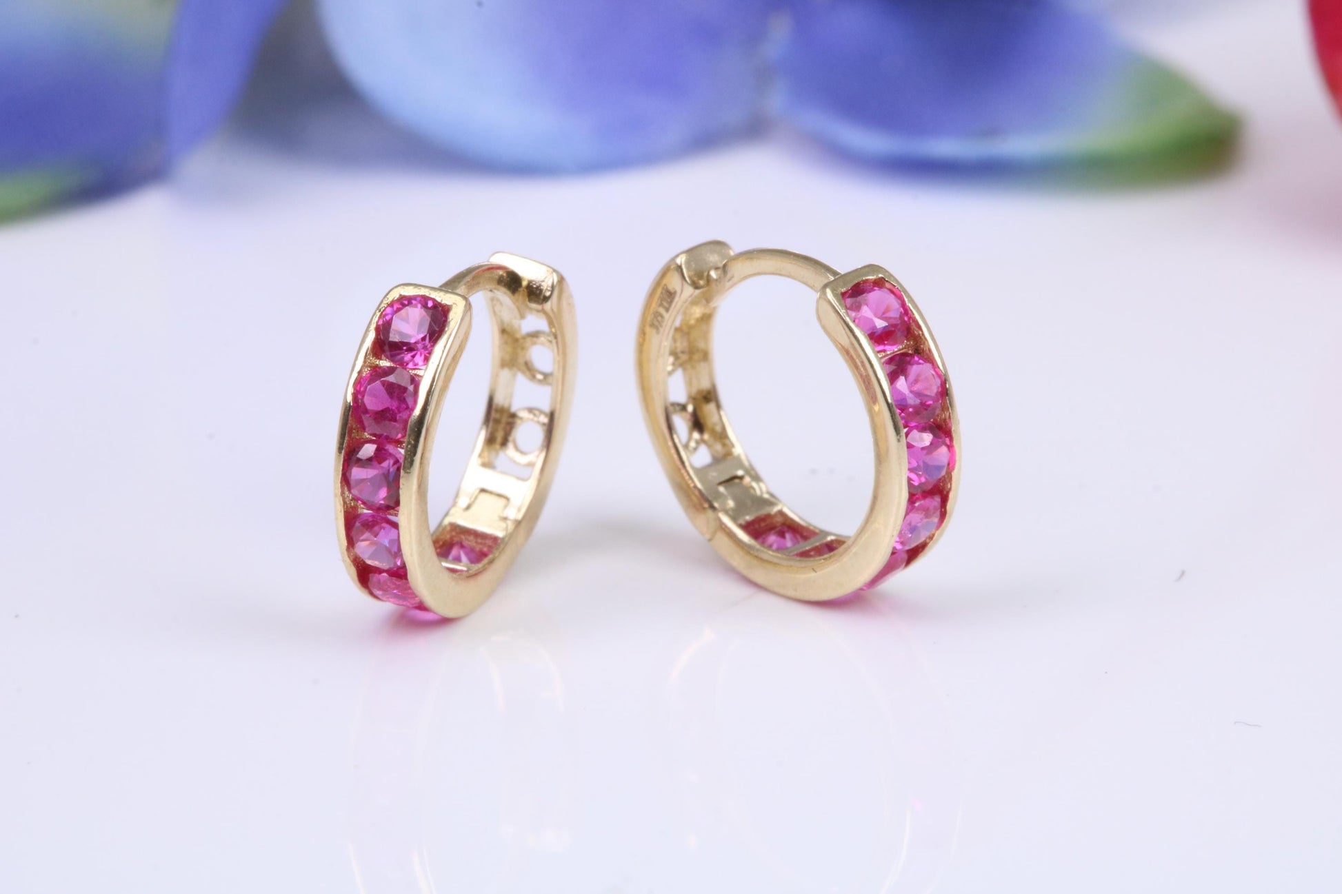 10 mm round hinged hoop earrings, made from solid yellow gold and set with Ruby Red Cubic Zirconia