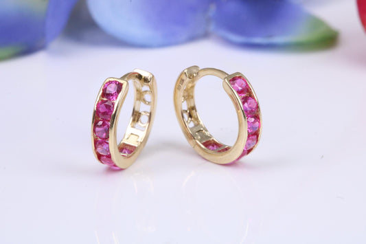 10 mm round hinged hoop earrings, made from solid yellow gold and set with Ruby Red Cubic Zirconia
