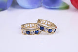 10 mm round hinged hoop earrings, made from solid yellow gold and set with Sapphire and Diamond Cubic Zirconia
