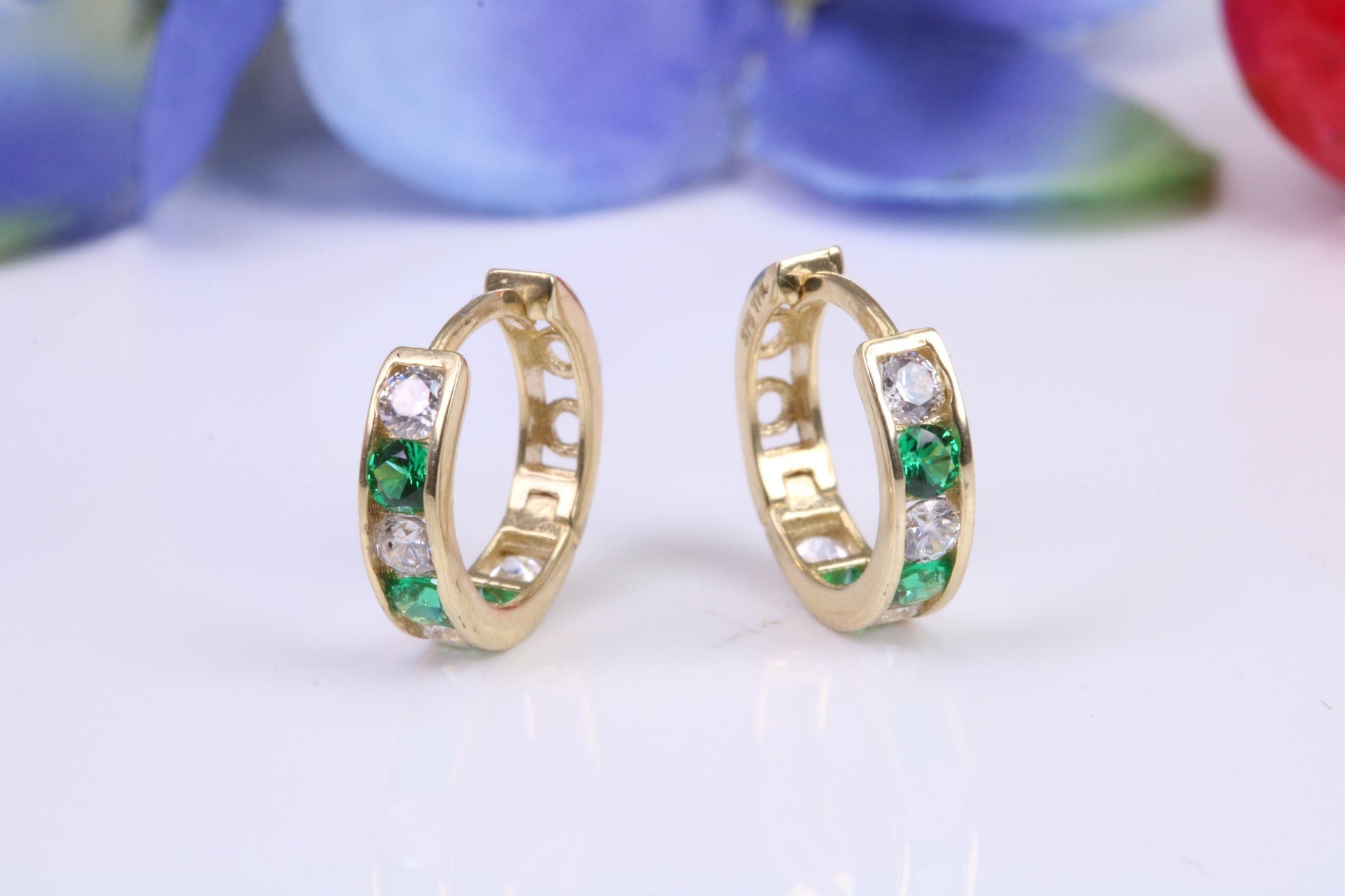 10 mm round hinged hoop earrings, made from solid yellow gold and set with Emerald and Diamond Cubic Zirconia