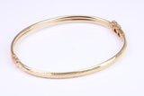Hinged 4 mm wide yellow gold oval Bangle, British hallmarked
