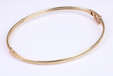 Hinged 3 mm wide yellow gold oval Bangle, British hallmarked