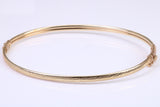 Hinged 3 mm wide yellow gold oval Bangle, British hallmarked