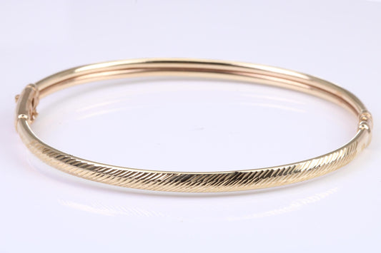 Hinged 4 mm wide yellow gold oval Bangle, British hallmarked