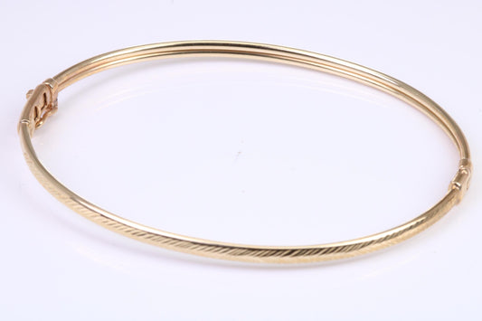 Hinged 3 mm wide yellow gold oval Bangle, British hallmarked