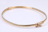 Hinged 3 mm wide yellow gold oval Bangle, British hallmarked