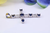 Sapphire Blue and Diamond White Cubic Zirconia Encrusted Cross Necklace, made from solid Sterling Silver