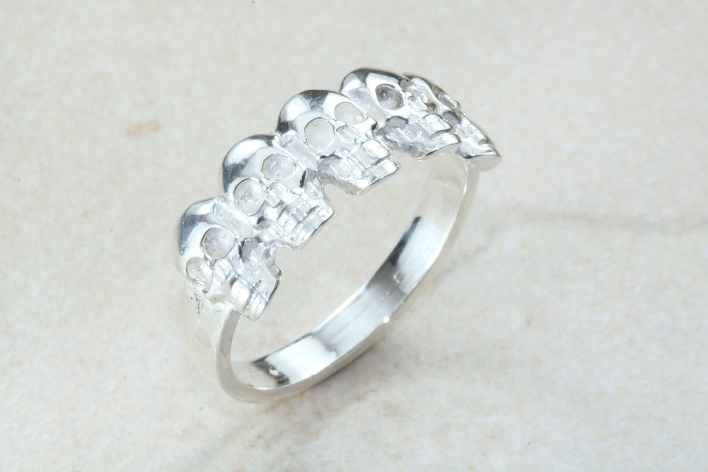 Skull ring,solid silver, 5 skulls around ring, perfect for ladies and gents. Available in Silver, Yellow gold, White gold and Platinum