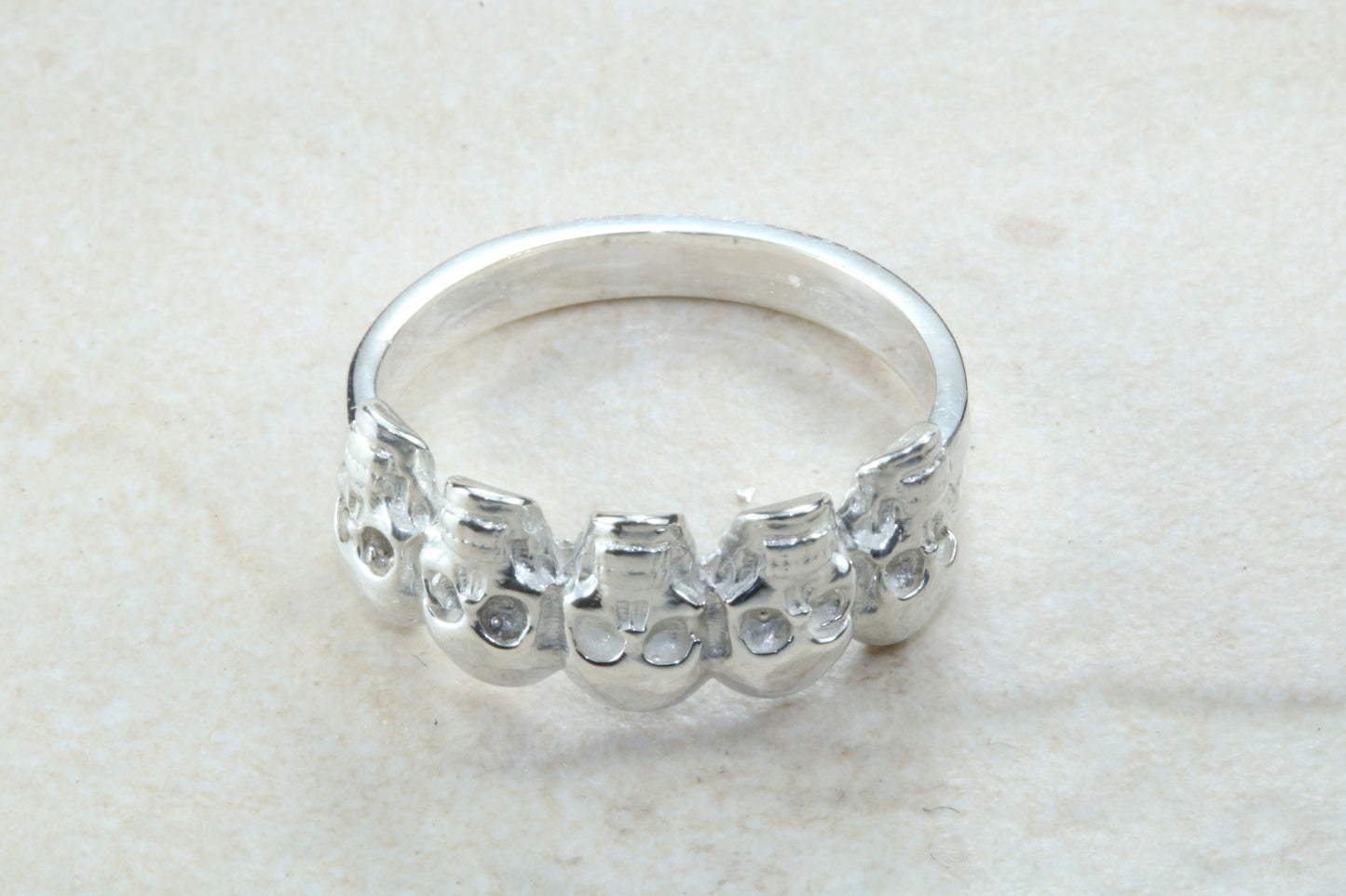 Skull ring,solid silver, 5 skulls around ring, perfect for ladies and gents. Available in Silver, Yellow gold, White gold and Platinum