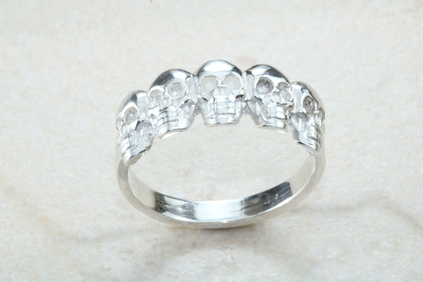 Skull ring,solid silver, 5 skulls around ring, perfect for ladies and gents. Available in Silver, Yellow gold, White gold and Platinum