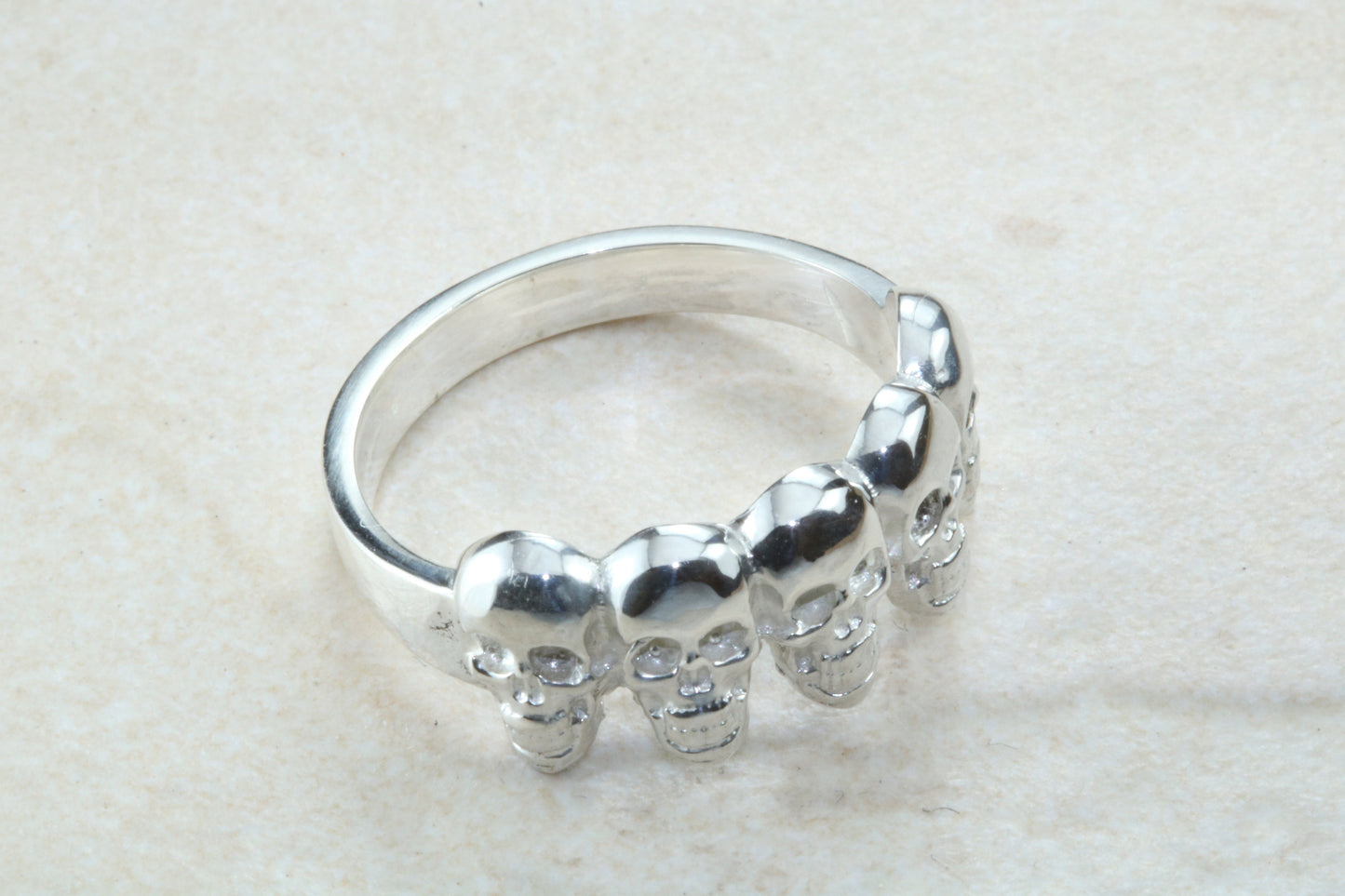 Skull ring,solid silver, 5 skulls around ring, perfect for ladies and gents. Available in Silver, Yellow gold, White gold and Platinum