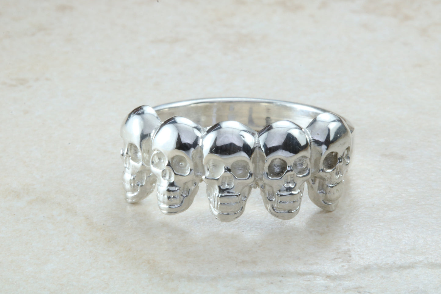 Skull ring,solid silver, 5 skulls around ring, perfect for ladies and gents. Available in Silver, Yellow gold, White gold and Platinum