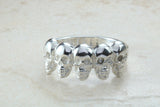 Skull ring,solid silver, 5 skulls around ring, perfect for ladies and gents. Available in Silver, Yellow gold, White gold and Platinum