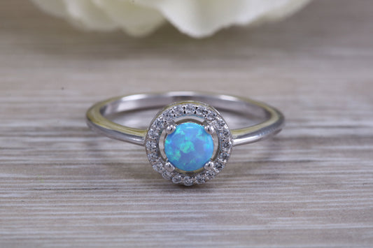 Very sparkly and fiery Opal and cubic zirconia set halo ring, solid sterling silver ring further rhodium plated for that platinum look