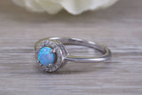 Very sparkly and fiery Opal and cubic zirconia set halo ring, solid sterling silver ring further rhodium plated for that platinum look
