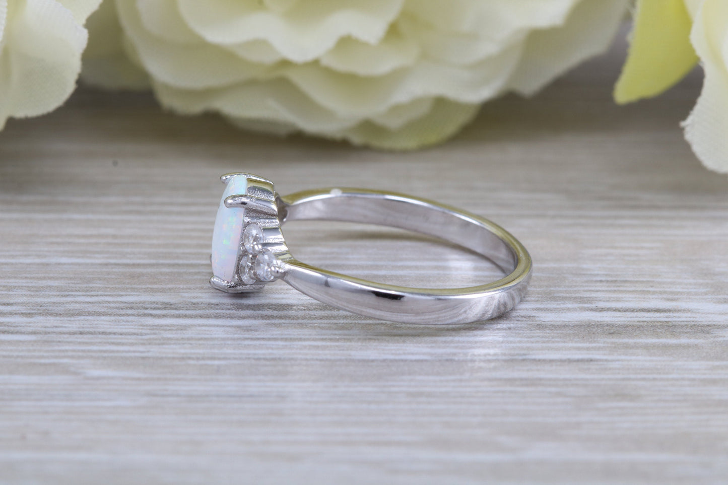 Very sparkly and fiery Opal and cubic zirconia set dress ring, solid sterling silver ring further rhodium plated for that platinum look