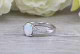 Very sparkly and fiery Opal and cubic zirconia set dress ring, solid sterling silver ring further rhodium plated for that platinum look