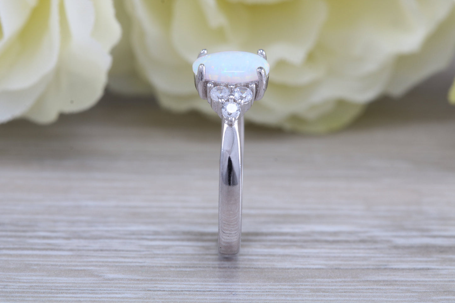 Very sparkly and fiery Opal and cubic zirconia set dress ring, solid sterling silver ring further rhodium plated for that platinum look