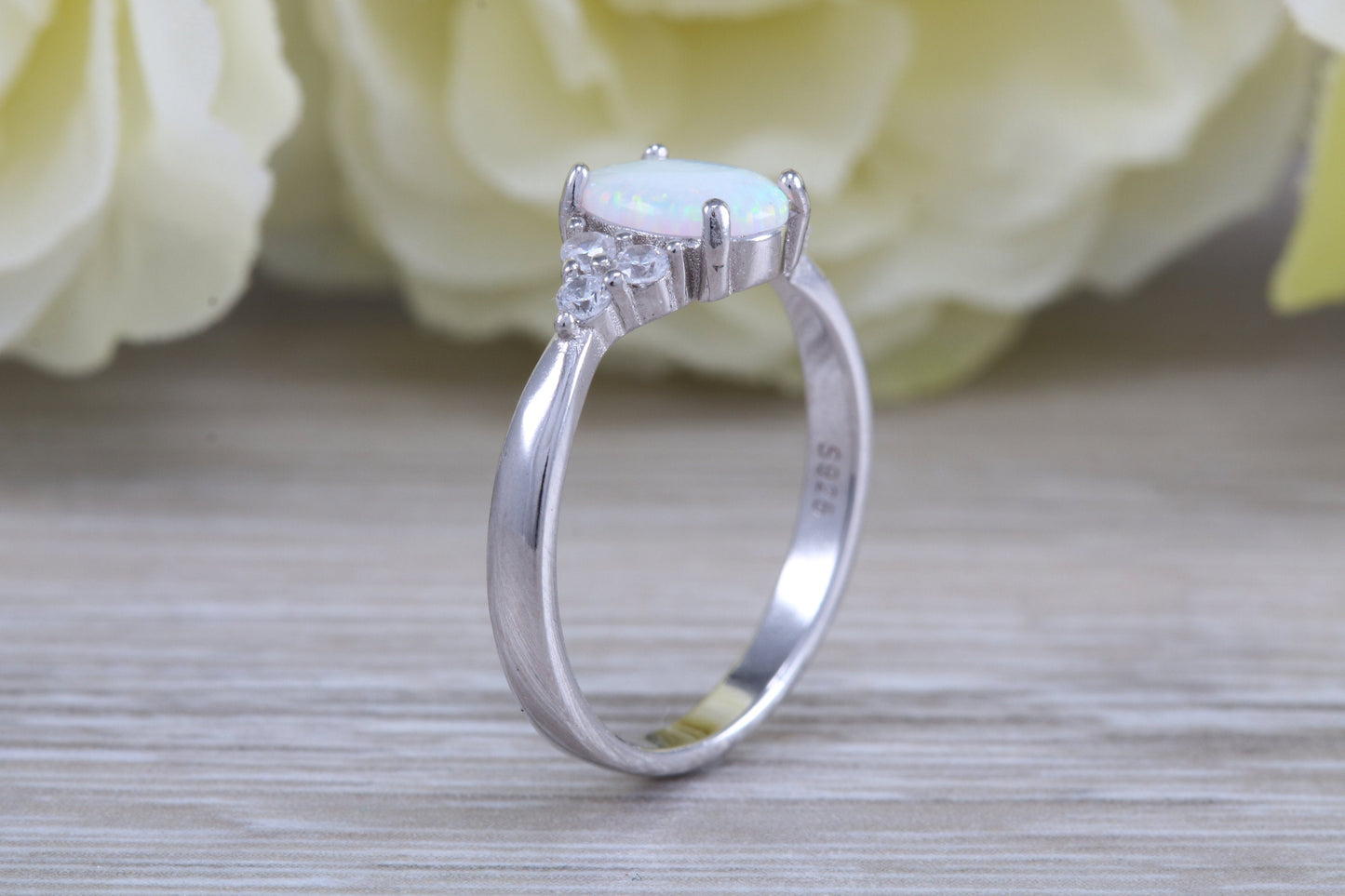 Very sparkly and fiery Opal and cubic zirconia set dress ring, solid sterling silver ring further rhodium plated for that platinum look