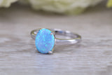 Very sparkly and fiery Opal solitaire, solid sterling silver ring further rhodium plated for that platinum look