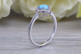 Very sparkly and fiery Opal and cubic zirconia set halo ring, solid sterling silver ring further rhodium plated for that platinum look