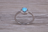 Very sparkly and fiery Opal and cubic zirconia set halo ring, solid sterling silver ring further rhodium plated for that platinum look