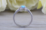 Very sparkly and fiery Opal and cubic zirconia set halo ring, solid sterling silver ring further rhodium plated for that platinum look