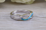 Fiery Blue Opal and cubic zirconia set cross over ring, solid sterling silver ring further rhodium plated for that platinum look