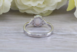 Very sparkly and fiery Opal and cubic zirconia set dress ring, solid sterling silver ring further rhodium plated for that platinum look