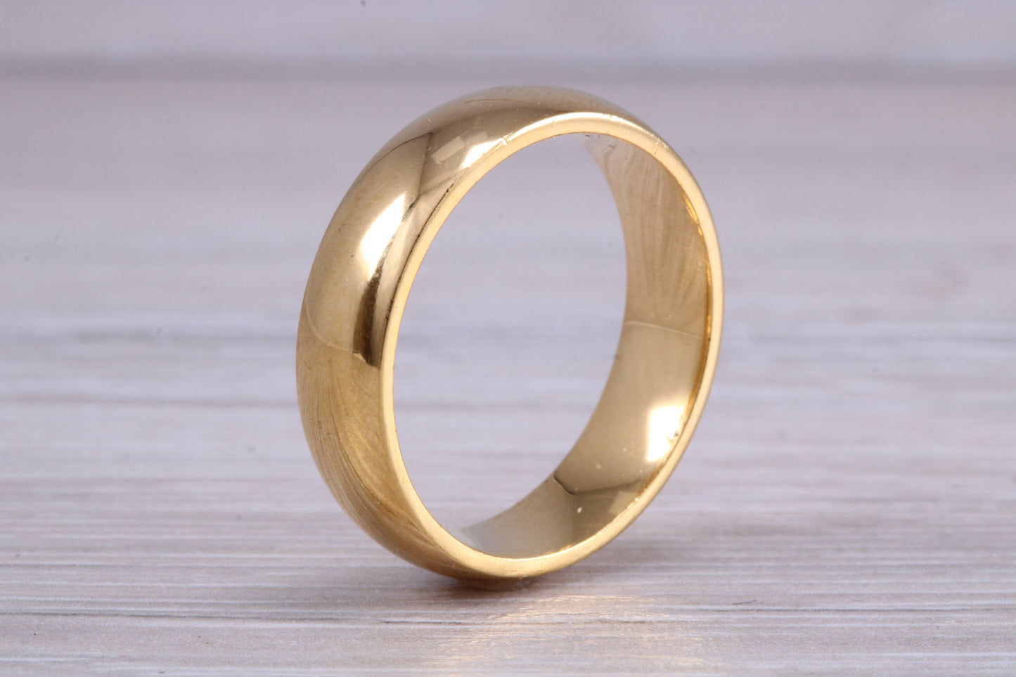 6 mm court profile Silver band with 18ct yellow Gold hard plating, looks just like a gold band for a fraction of the cost