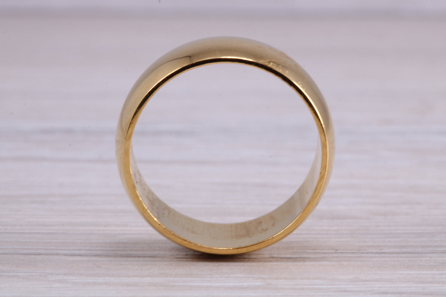 8 mm court profile Silver band with 18ct yellow Gold hard plating, looks just like a gold band for a fraction of the cost. Very wide band