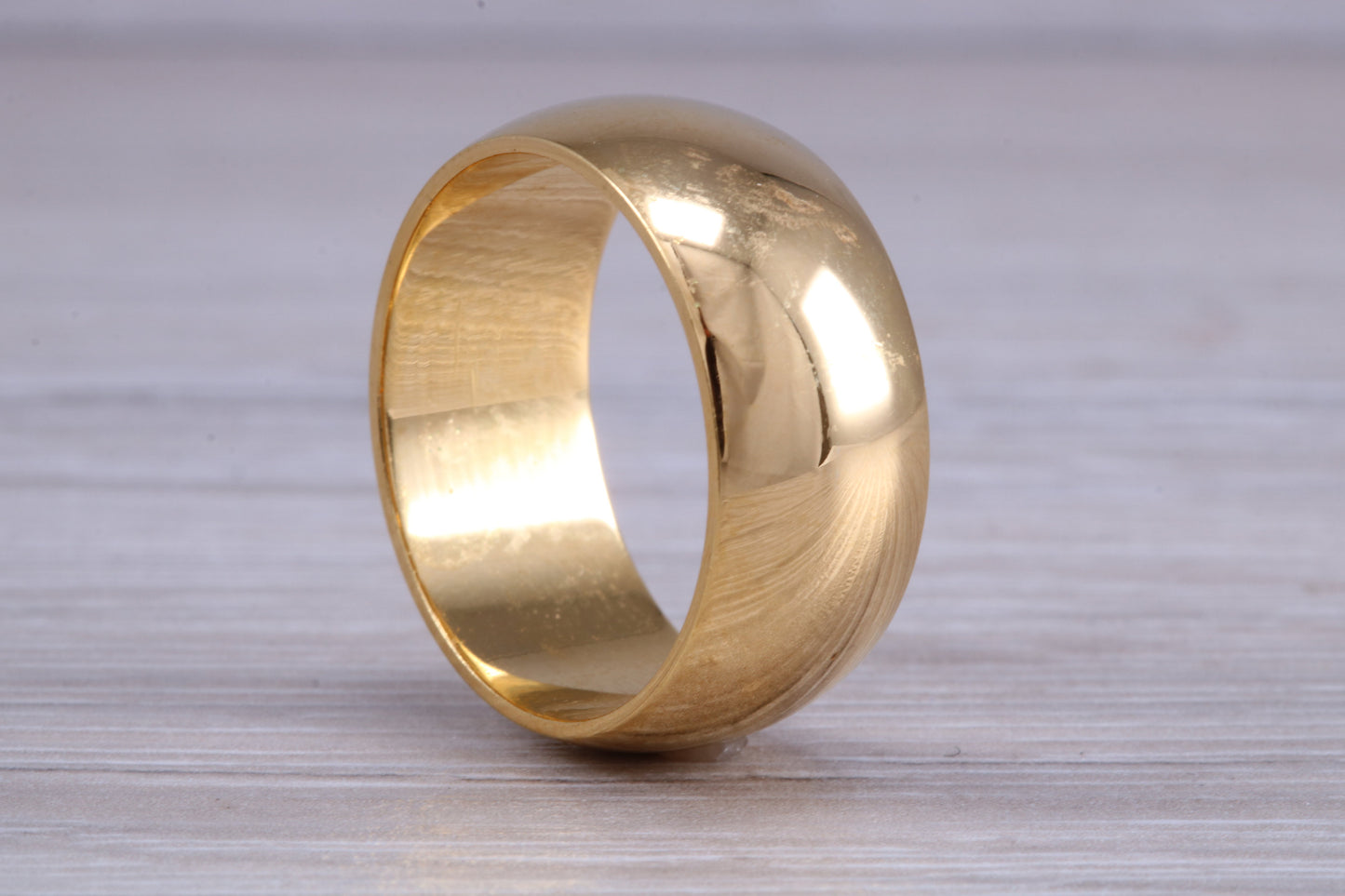8 mm court profile Silver band with 18ct yellow Gold hard plating, looks just like a gold band for a fraction of the cost. Very wide band