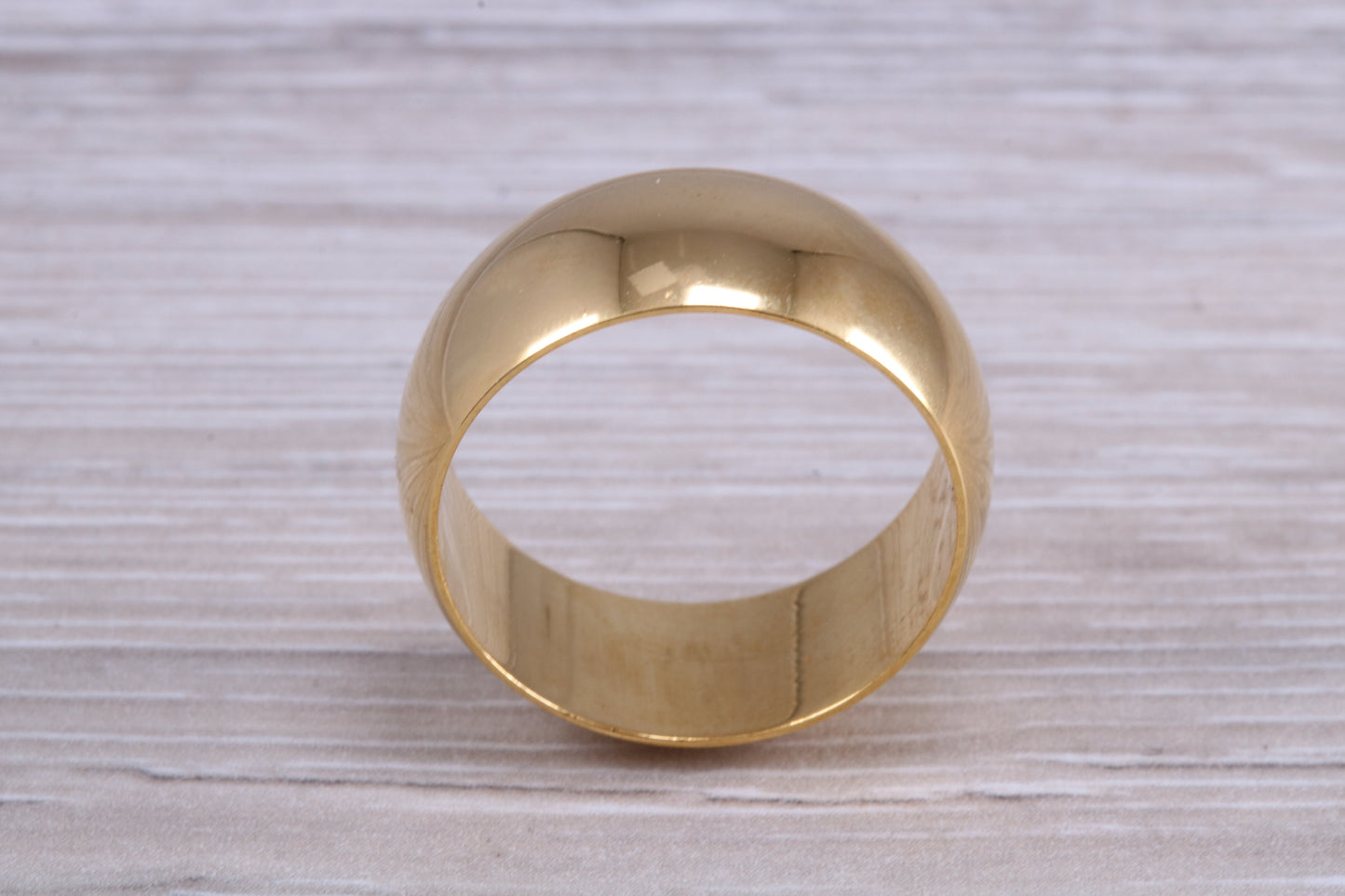10 mm court profile Silver band with 18ct yellow Gold hard plating, looks just like a gold band for a fraction of the cost. Very wide band
