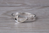 Scroll design ring, solid silver with high polished finish, very dainty and suitable for all ages
