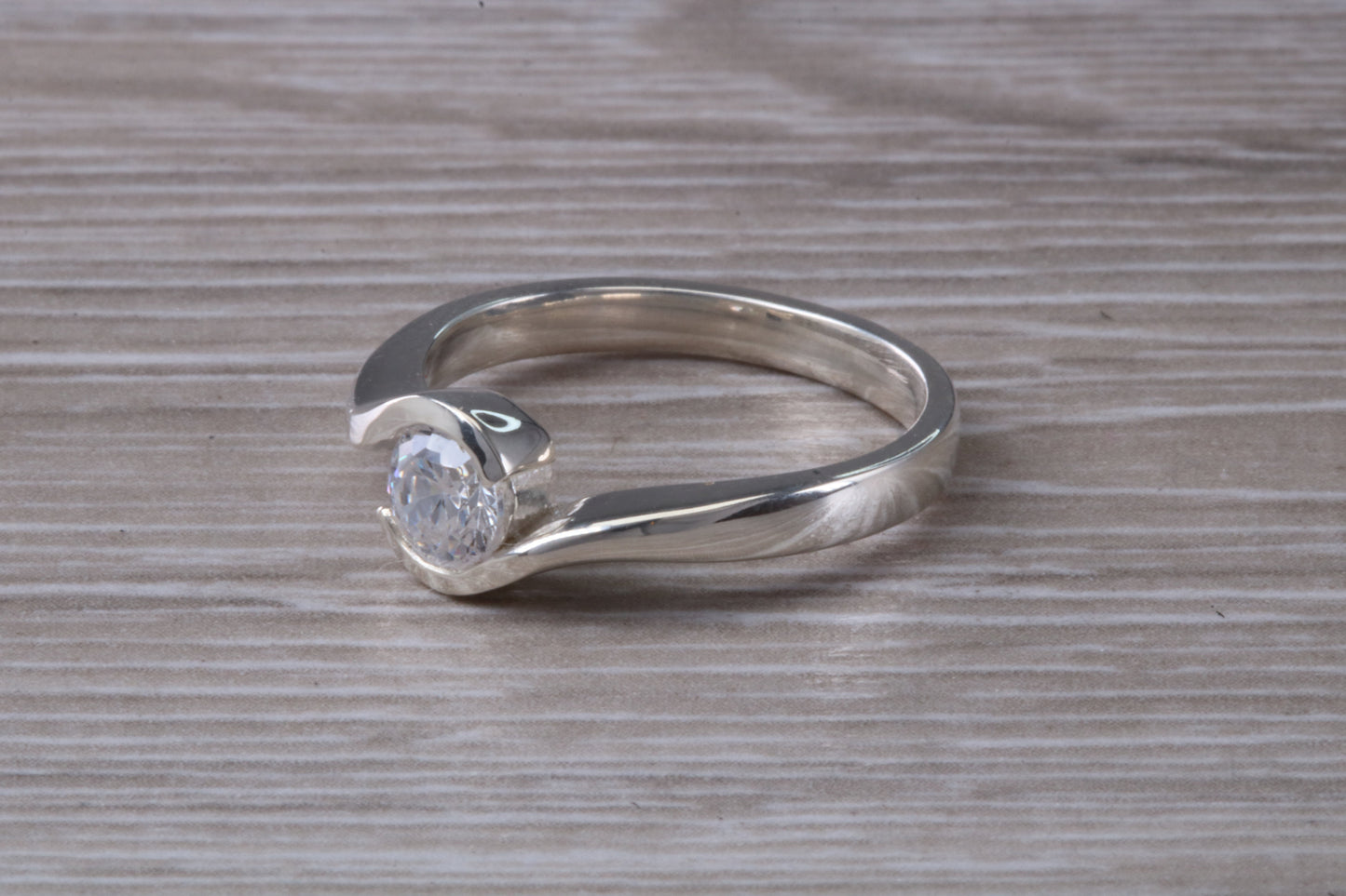Simple and very elegant real Diamond look ring, sterling silver set with half carat diamond look C Z, very smooth rub over setting
