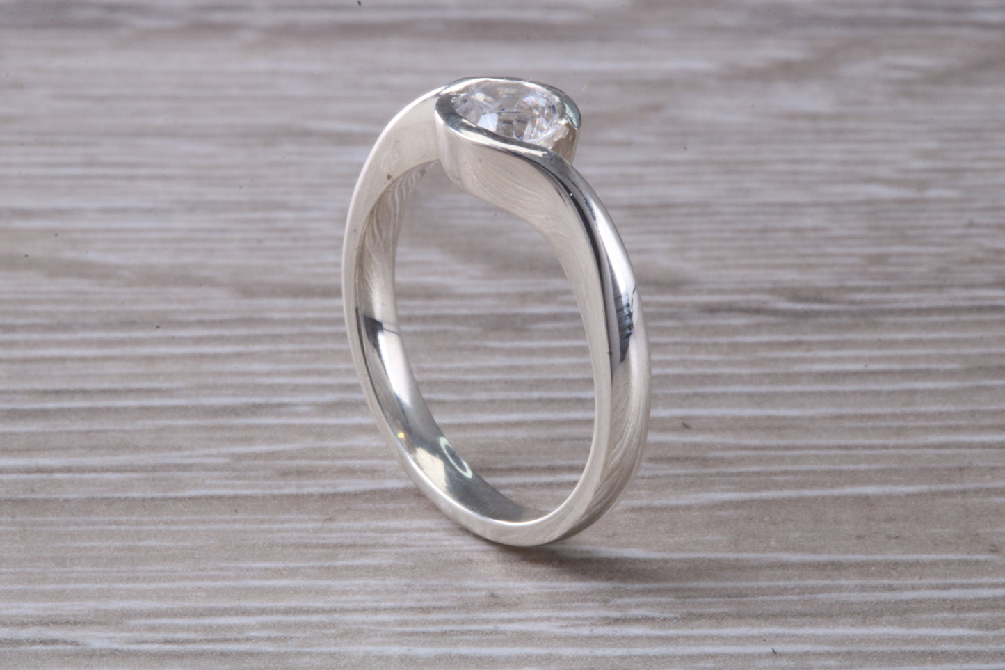 Simple and very elegant real Diamond look ring, sterling silver set with half carat diamond look C Z, very smooth rub over setting