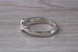 Simple and very elegant real Diamond look ring, sterling silver set with half carat diamond look C Z, very smooth rub over setting