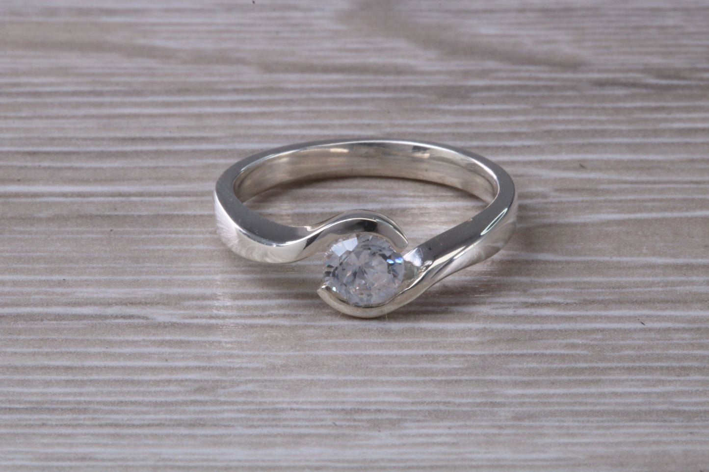 Simple and very elegant real Diamond look ring, sterling silver set with half carat diamond look C Z, very smooth rub over setting