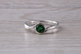 Simple and very elegant real Emerald look ring, sterling silver set with half carat Emerald C Z, very smooth rub over setting