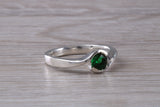 Simple and very elegant real Emerald look ring, sterling silver set with half carat Emerald C Z, very smooth rub over setting