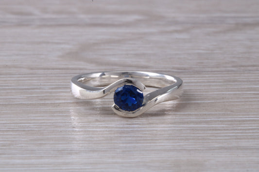 Simple and very elegant real Blue Sapphire look ring, sterling silver set with half carat Sapphire C Z, very smooth rub over setting