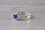 Simple and very elegant real Blue Sapphire look ring, sterling silver set with half carat Sapphire C Z, very smooth rub over setting