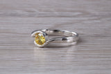 Simple and very elegant real Yellow Sapphire look ring, sterling silver set with half carat Sapphire C Z, very smooth rub over setting